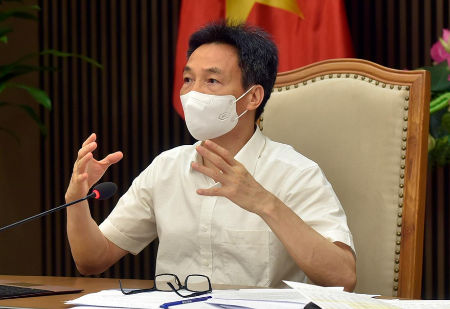 Phó Thủ tướng Vũ Đức Đam chủ trì cuộc họp với lãnh đạo TPHCM về phòng chống dịch COVID-19 ngày 5/7. Ảnh: Đình Nam