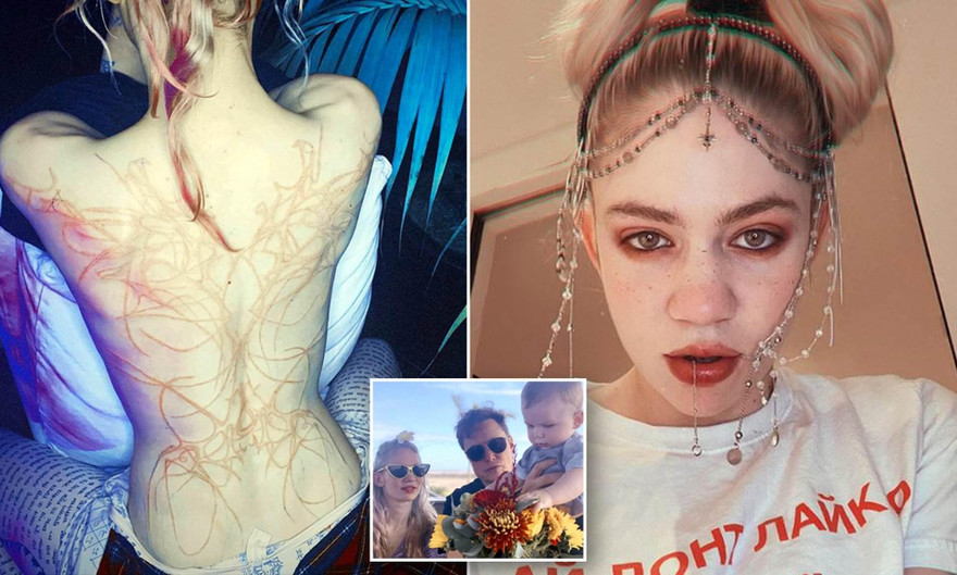 Bạn gái tỷ phú Elon Musk khoe hình xăm kín lưng