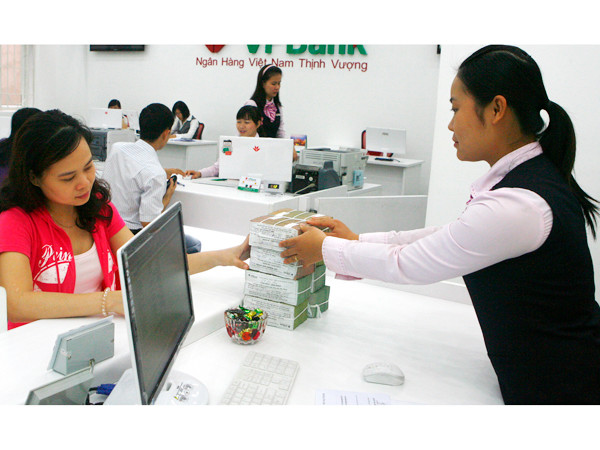 Dù lãi suất ưu đãi nhưng nhiều DN (trong diện ưu đãi) vẫn không thể tiếp cận được vốn với lãi suất 15% (Ảnh minh họa của Hồng Vĩnh)