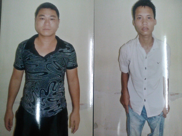 Hải (trái) tại cơ quan điều tra