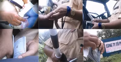 Phóng viên báo Tiền Phong ghi lại hình ảnh CSGT nhận hối lộ