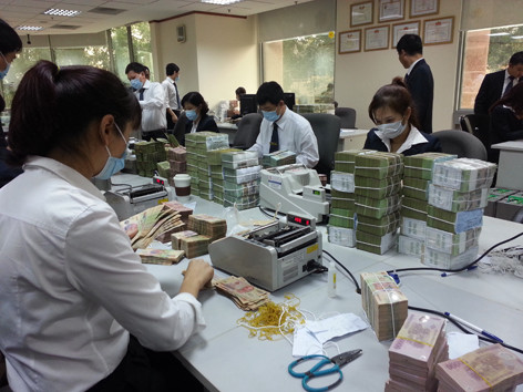 Đánh thuế tiền gửi ngân hàng: Doanh nghiệp chịu thuế hai lần?