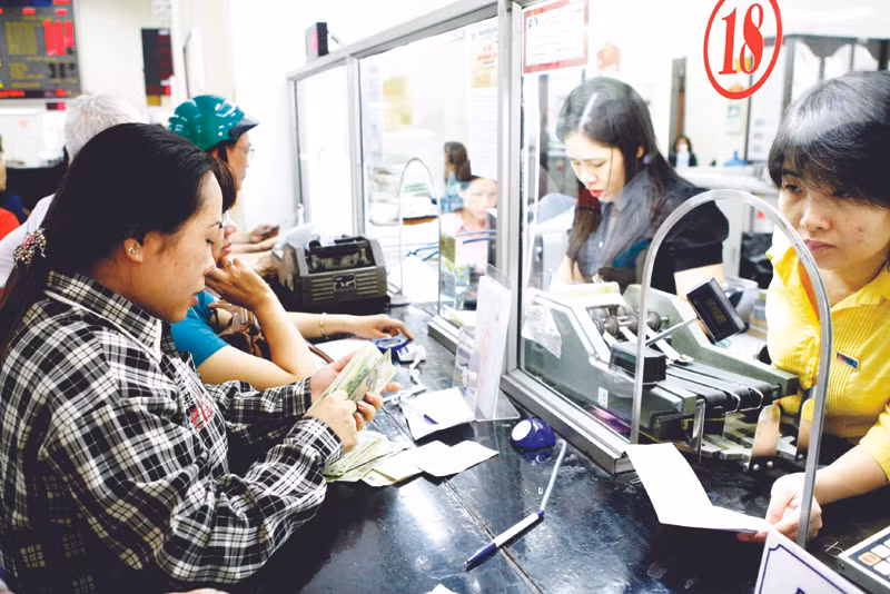 Tái cấu trúc hệ thống ngân hàng là một trong những nhiệm vụ cần thực hiện trong thời gian tới. Ảnh minh họa: Hồng Vĩnh
