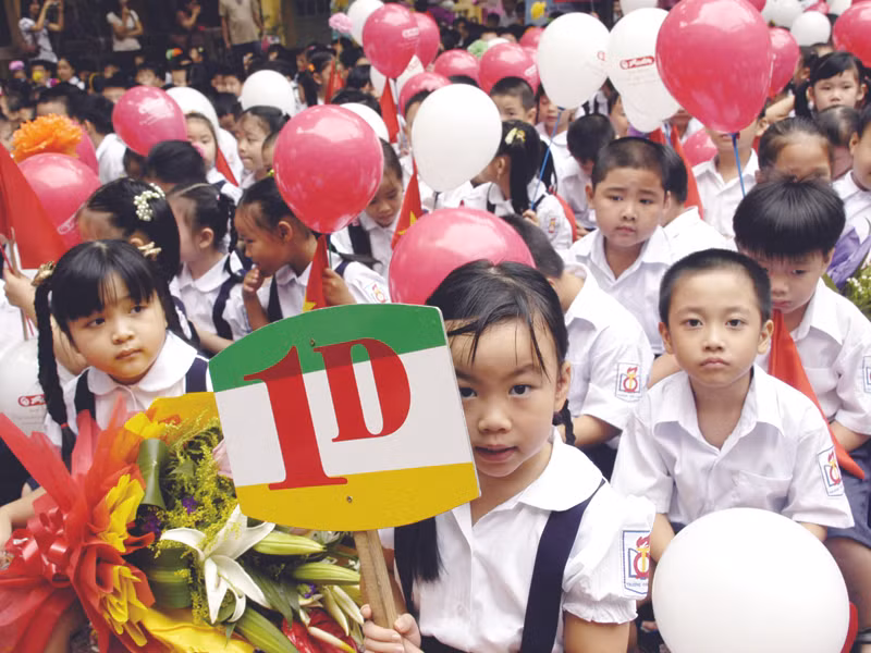 Học sinh lớp 1 trường THCS Quang Trung - Quận Hoàn Kiếm - TP Hà Nội, ngày khai giảng. Ảnh: Phạm Yên
