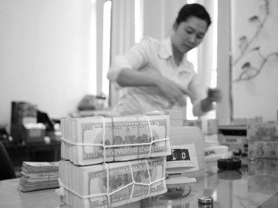 Hạ lãi suất, doanh nghiệp, nhà đầu tư phản ứng gì? Ảnh: PV