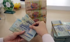 Bộ Tài chính thông tin việc không cấm trả lương trên 5 triệu bằng tiền mặt
