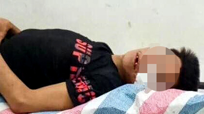 Đối tượng Nấu sau khi gây án bị người thân đánh, hiện đang cấp cứu tại bệnh viện .Ảnh: Duy Chiến