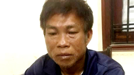 Nghi phạm Nguyễn Trung Chao khai báo tại cơ quan công an. Ảnh: N.T