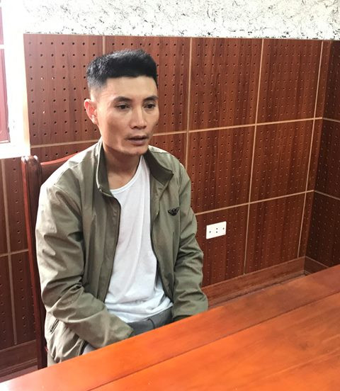 Đối tượng Vũ Văn Trung khai báo hành vi lừa đảo tại cơ quan công an *ảnh: TL