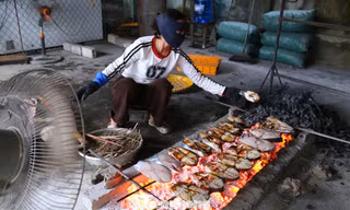 Khom lưng nướng cá cả ngày lẫn đêm cận Tết