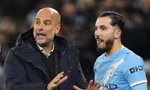 Rayan Cherki và Pep Guardiola.
