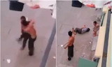 Đứa bé hoảng loạn chứng kiến cảnh bố cứa cổ mẹ. Ảnh cắt từ clip