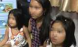 Hai bé gái ở cùng nữ giúp việc khi cảnh sát giải cứu. Ảnh: Công an cung cấp