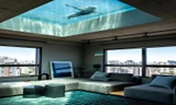 Căn hộ áp mái lấy hồ bơi trong suốt làm giếng trời