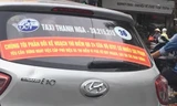 Hà Nội yêu cầu taxi bỏ khẩu hiệu phản đối Uber, Grab