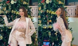Thuỳ Tiên mặc crop-top đính lông vũ nóng bỏng khi đón Giáng Sinh cùng chủ tịch Miss Grand