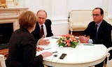 Tổng thống Nga Vladimir Putin, Tổng thống Pháp Francois Hollande và Thủ tướng Đức Angela Merkel trong cuộc gặp tại Điện Kremlin. (Nguồn: Reuters)
