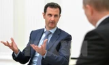 Tổng thống Syria Bashar al-Assad (trái) trong cuộc gặp với Tổng thống Nga Vladimir Putin (phải) tại thủ đô Moskva, Nga ngày 21/10. (Nguồn: AFP/TTXVN)