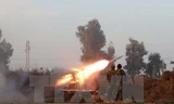 Binh sỹ Iraq trong cuộc giao tranh với các tay súng IS. (Ảnh: AFP/TTXVN)