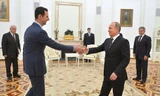 Tổng thống Syria Assad (trái) bất ngờ tới Nga vào hôm qua, ngày 20/10. Ảnh: RIA Novosti
