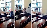 Nhóm nữ sinh hung hăng đánh em P. trong khi P. bị cô lập trong góc tường lớp học - Ảnh cắt từ video clip