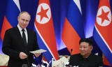 Tổng thống Nga Vladimir Putin và Chủ tịch Triều Tiên Kim Jong Un tại tiệc chiêu đãi ở Bình Nhưỡng ngày 19/6. (Ảnh: Sputnik)