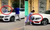 Bị thách thức,người phụ nữ cầm dao, búa đập phá xe đỗ trước cửa nhà