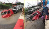'Hố tử thần' nuốt chửng đầu xe container ở Hà Nội