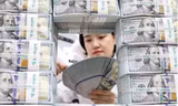 Trung Quốc giảm lượng trái phiếu chính phủ Mỹ trong 6 tháng liên tục. (Ảnh: EPA-EFE)