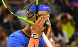 Nadal ôm mặt sau một pha đánh hỏng. Ảnh: Reuters.