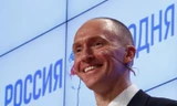 Cựu cố vấn của Tổng thống Mỹ Donald Trump, Carter Page, giao lưu với khán giả tại buổi diễn thuyết ở Moscow, Nga, ngày 12/12/2016. Ảnh: Reuters
