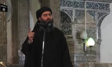 Thủ lĩnh tối cao của IS, Abu Bakr al-Baghdadi trong lần xuất hiện cuối cùng vào năm 2014 ở Mosul. Ảnh: AFP 