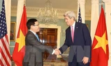 Phó Thủ tướng, Bộ trưởng Ngoại giao Phạm Bình Minh và Ngoại trưởng Mỹ John Kerry tại cuộc hội đàm hôm qua. Ảnh: TTXVN