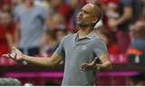 Guardiola nhận thất bại trước đội bóng cũ Bayern. Ảnh: Reuters.