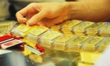 Giá vàng đảo chiều giảm nhẹ, tỷ giá chững lại