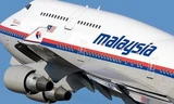 Một em bé cầu nguyện cho chuyến bay MH370