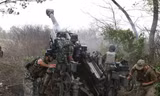 Lính Ukraine bắn pháo M777 ở vùng Kharkov, đông bắc Ukraine. (Ảnh: Getty)