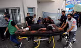 Số người chết vì bom đạn ở Dải Gaza đã vượt mốc 10.000. (Ảnh: AP)