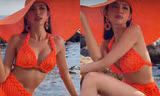 Hoa hậu Thuỳ Tiên mặc bikini đỏ rực, khoe dáng nóng bỏng tựa 'nàng tiên cá' trên biển