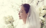 Cô dâu Choi Ji Woo xinh đẹp, rạng rỡ trong trang phục cô dâu. Ảnh: YG