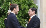Thủ tướng Chính phủ Phạm Minh Chính và Tổng thống Cộng hòa Pháp Emmanuel Macron. (Ảnh: Dương Giang/TTXVN)