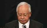 Thủ tướng Malaysia Najib Razak đau buồn thông báo chuyến bay MH370 đã đâm xuống Nam Ấn Độ Dương. Ảnh: Reuters