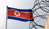Quốc kỳ Triều Tiên bên tại Đại sứ quán Triều Tiên ở Malaysia. (Ảnh: Reuters)