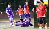 Các cầu thủ U23 (ảnh lớn) có buổi tập mệt nhoài ngay ngày đầu tới Singapore trong lúc HLV Miura (ảnh nhỏ) luôn đăm chiêu suốt buổi tập. Ảnh: VSI