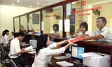 Người dân Hà Nội có thể làm thủ tục hành chính qua bưu điện