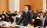Bộ trưởng Bộ Tư pháp Lê Thành Long trả lời chất vấn ĐB Nguyễn Ngọc Phương (Quảng Bình)​. Ảnh: TTXVN.