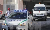Xe cảnh sát và xe cứu thương mang thi thể ông Kim Jong-nam rời bệnh viện ở Putrajaya, Malaysia ngày 15/2. (Nguồn: EPA/TTXVN)