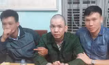Nguyễn Văn Tình sau khi bị cảnh sát bắt giữ.