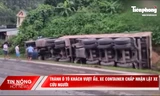 Tránh xe khách vượt ẩu, container lao xuống rãnh nước rồi lật nghiêng