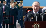 Tổng thống Nga Vladimir Putin phát biểu trên Quảng trường Đỏ dịp kỷ niệm Chiến thắng phát xít 9/5/2024 và trợ lý cầm vali đen được cho là cheget. Ảnh: Reuters.